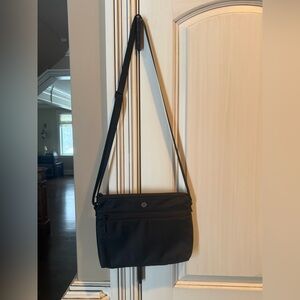 This is a Lululemon New Parent Crossbody Bag in black